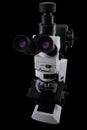Oculars side research microscope view isolated on a black background
